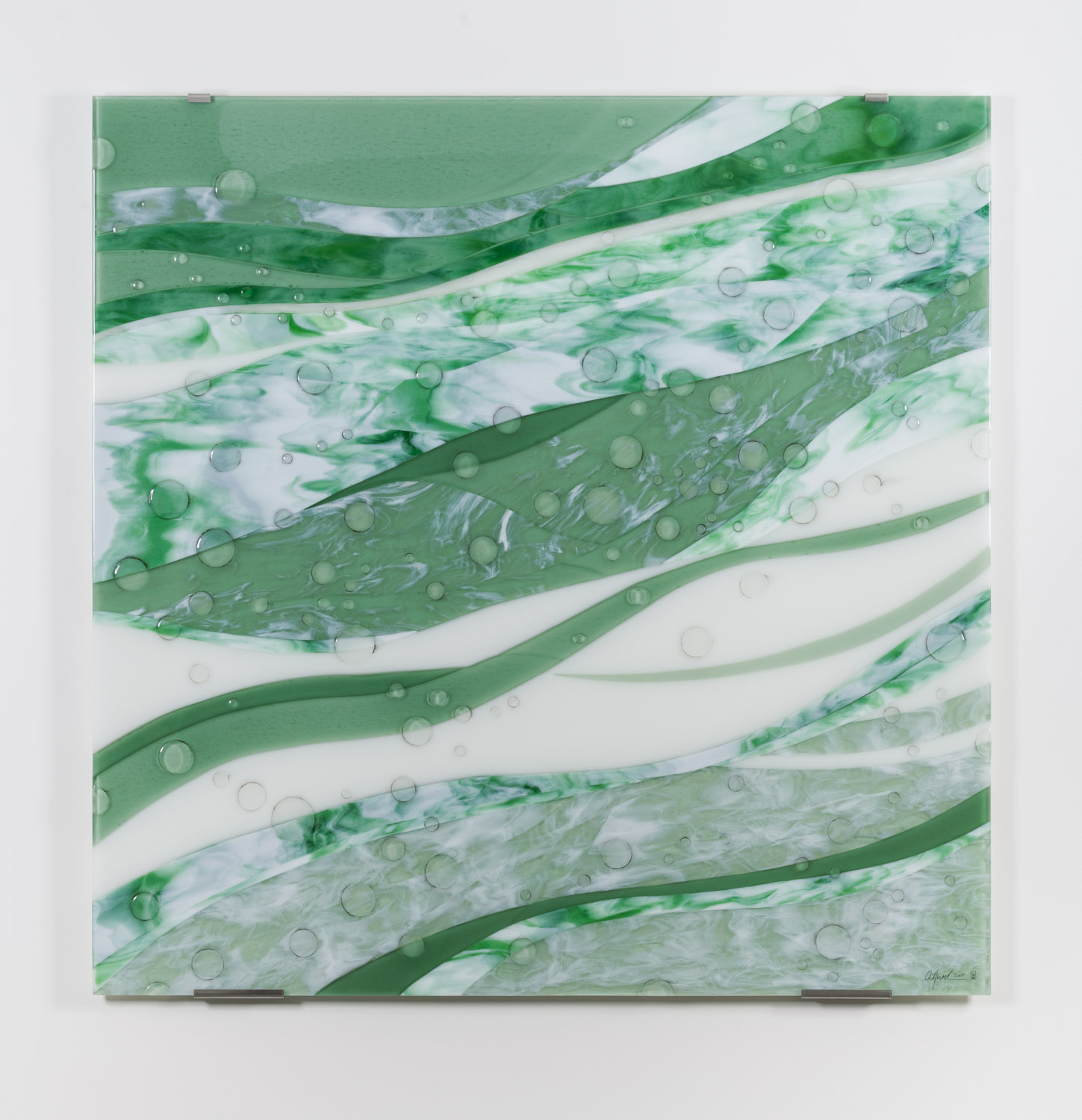 This artwork features an abstract design with flowing, wave-like patterns in shades of green, white, and subtle hints of blue. The composition creates a sense of movement, resembling swirling water or natural elements like leaves or grass. Small, circular bubbles are scattered throughout, adding texture and depth to the piece. The overall aesthetic is calming and dynamic, emphasizing fluidity and harmony in the color palette and design.