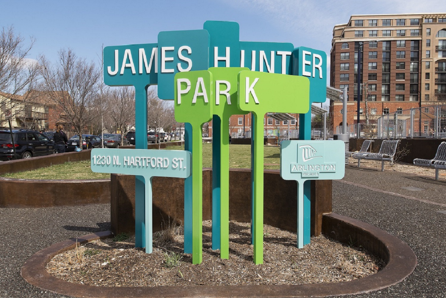 A colorful, abstract sign with the words 